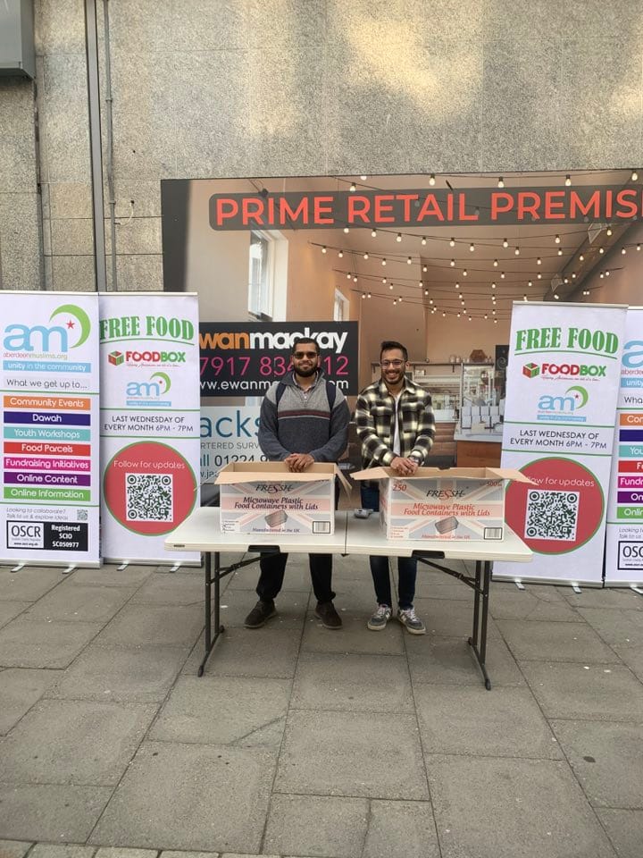 Mohammed and Sufian at the Monthly Foodbox Stall